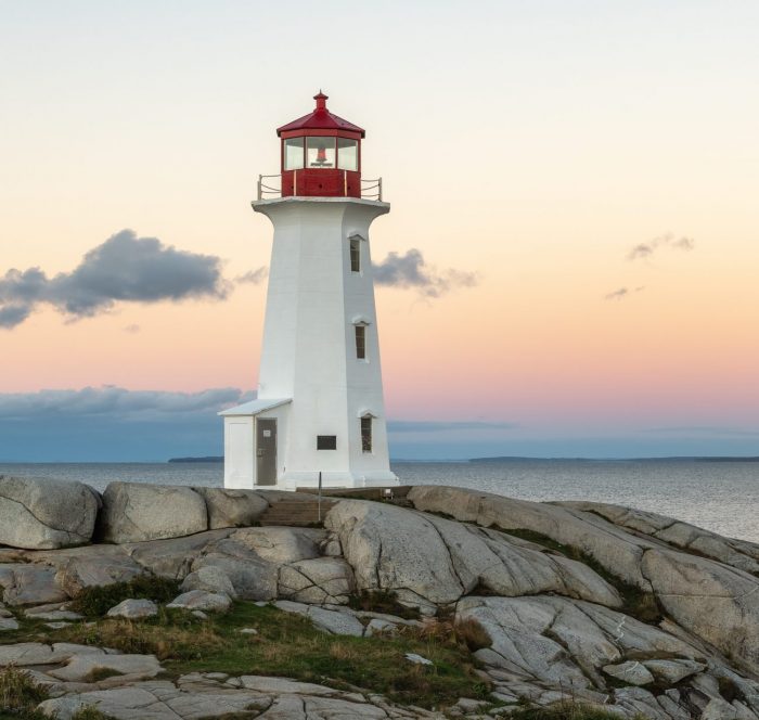 Peggys Cove Lighthouse with yellow sky in Halifax